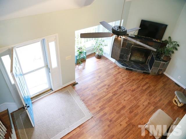 2300 Rolesville Road Wake Forest, NC 27587 - Photo 7 of 24 a view of a livingroom with furniture wooden floor windows and a fireplace