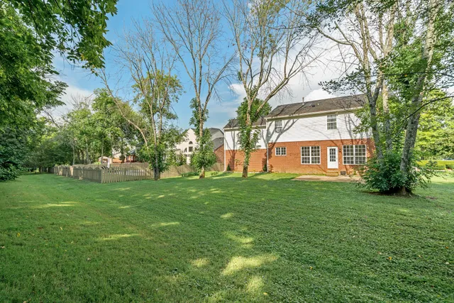 a view of a yard in front of a house
