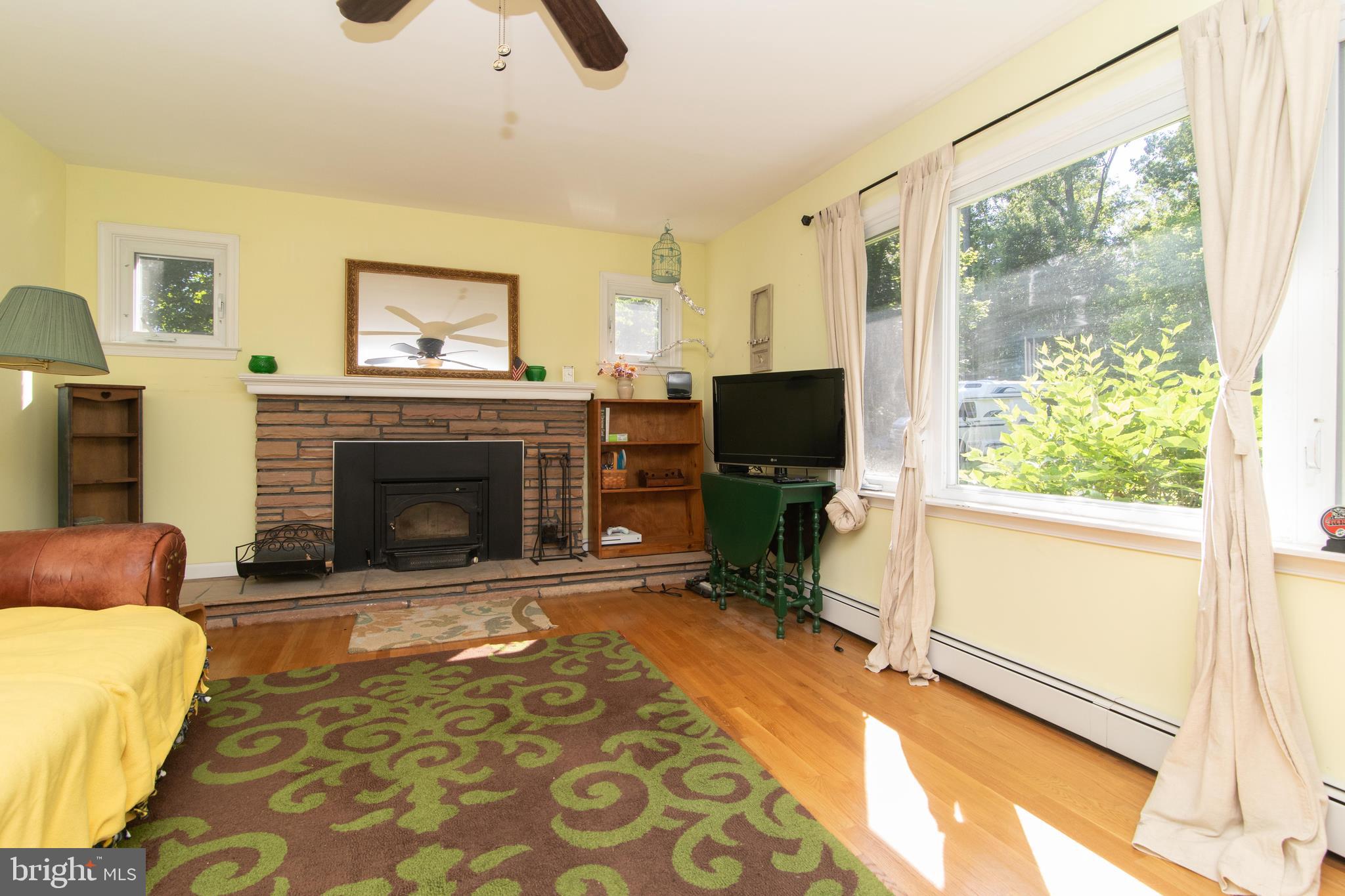 122 Durham Road Newtown, PA 18940 - Photo 14 of 26 Family room with wood stove insert