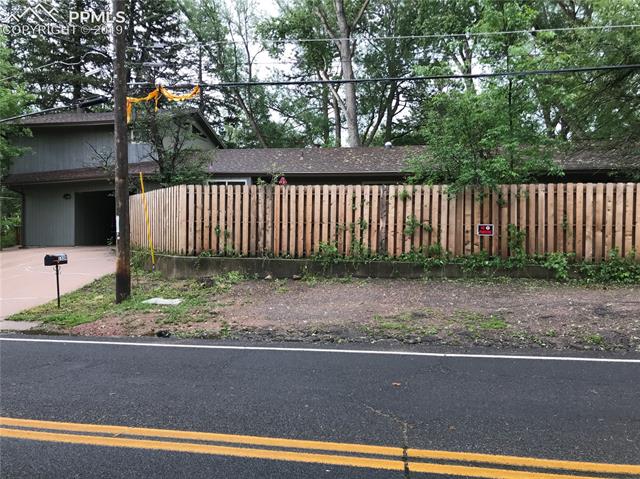 1539 West Cheyenne Road Colorado Springs, CO 80906 - Photo 27 of 29 Front patios are fenced in. Additional parking in front of this fence for tenants/owner
