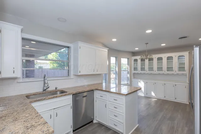 a kitchen with sink and window