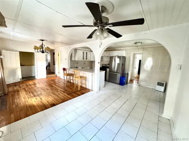 a view of a living room and bathroom