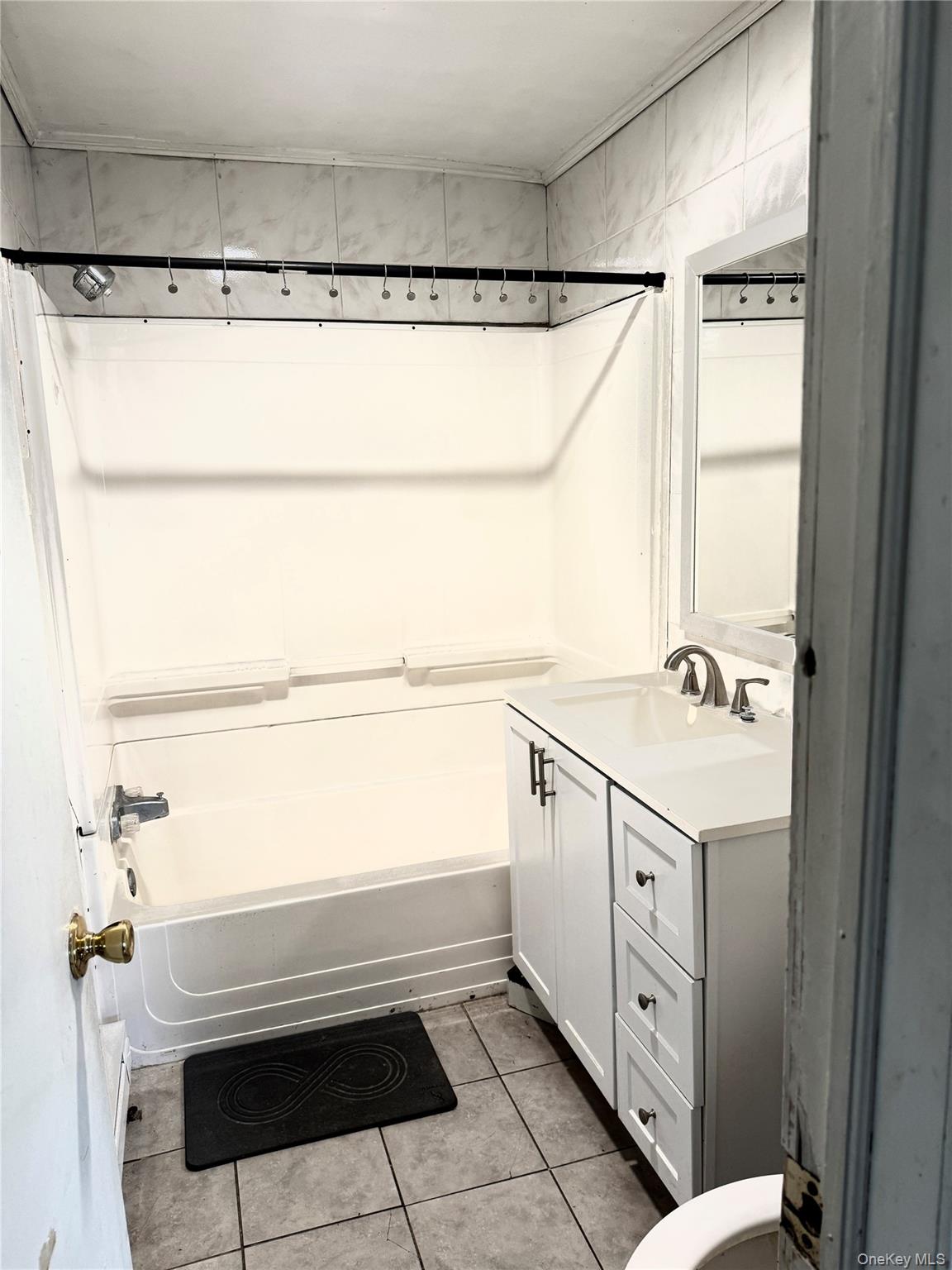 152 Forest Glen Road, Unit 4 New Paltz, NY 12561 - Photo 7 of 12 a bathroom with a sink and a mirror