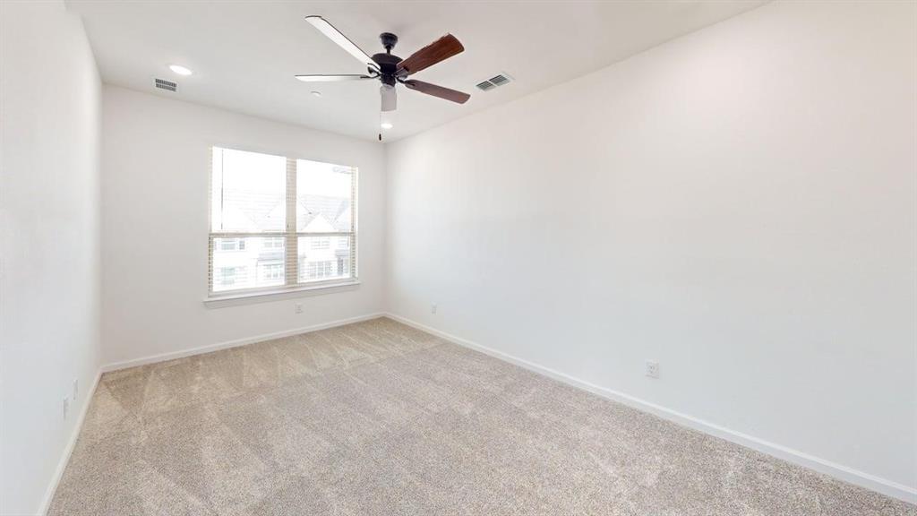 285 Buck Ridge Drive Little Elm, TX 75068 - Photo 15 of 20 an empty room with a window and a fan