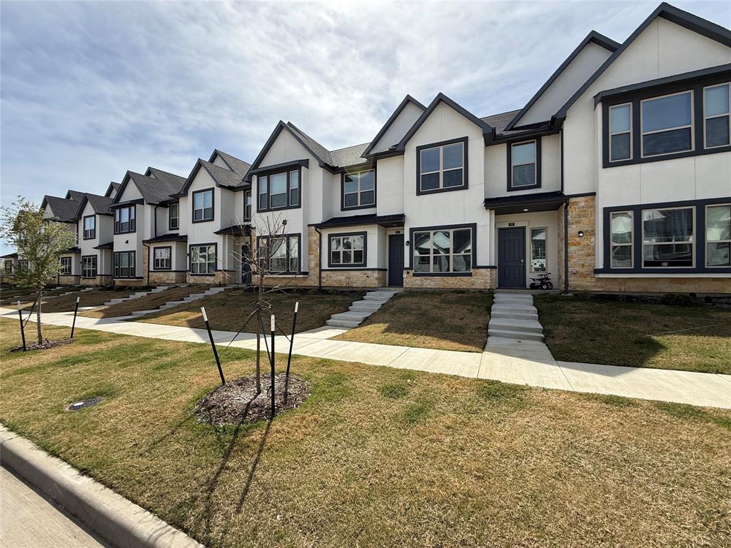 285 Buck Ridge Drive Little Elm, TX 75068 - Photo 2 of 20 a view of an house with backyard and a tree