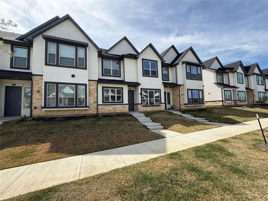 285 Buck Ridge Drive Little Elm, TX 75068 - Photo 3 of 20 a front view of a house with a yard