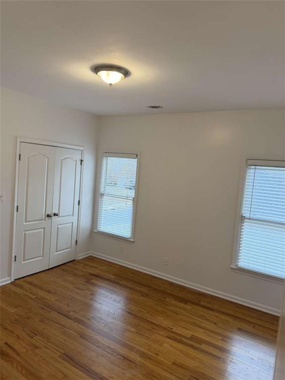 105 Beracah Walk Atlanta, GA 30331 - Photo 13 of 17 a view of empty room with wooden floor and fan