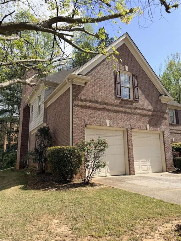 105 Beracah Walk Atlanta, GA 30331 - Photo 16 of 17 a front view of a house with a yard