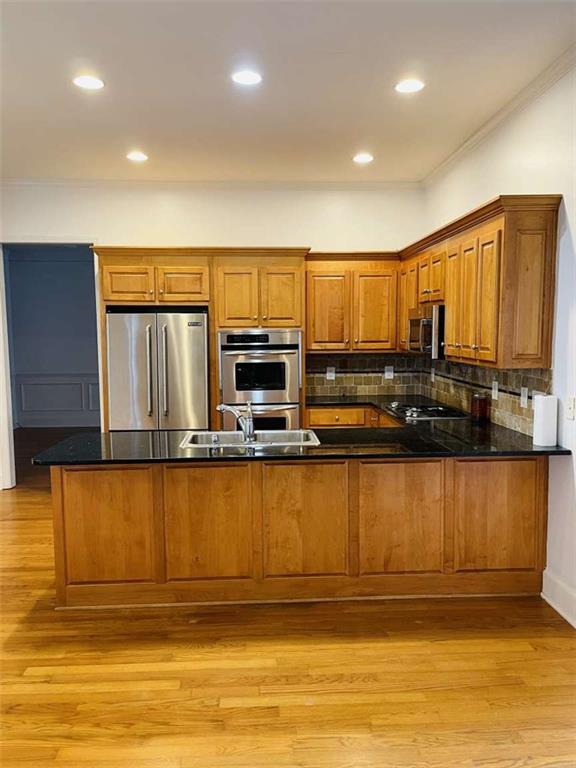 105 Beracah Walk Atlanta, GA 30331 - Photo 3 of 17 a kitchen with stainless steel appliances granite countertop a stove a sink and a microwave