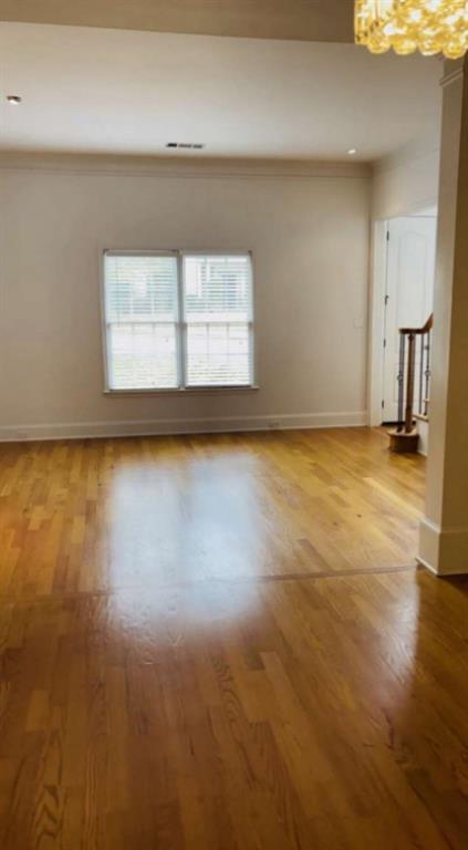 105 Beracah Walk Atlanta, GA 30331 - Photo 7 of 17 a view of an empty room with wooden floor and a cabinet