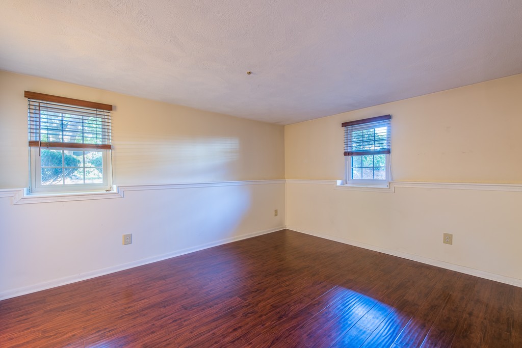 360 Neponset Street, Unit 702 Canton, MA 02021 - Photo 3 of 6 a view of a room with wooden floor and windows