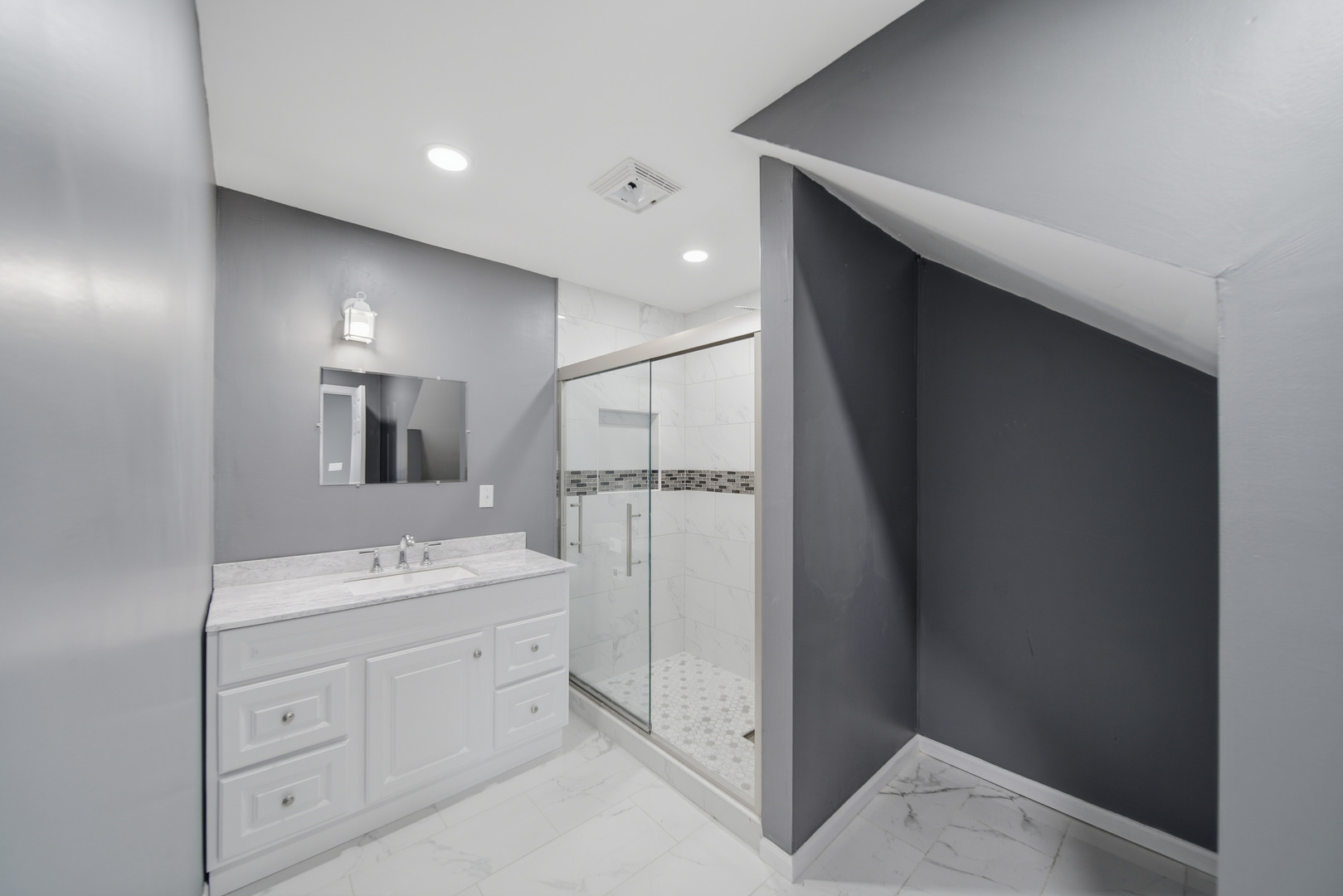 503 West Winfield Street Morrison, IL 61270 - Photo 9 of 22 a bathroom with a shower sink and mirror