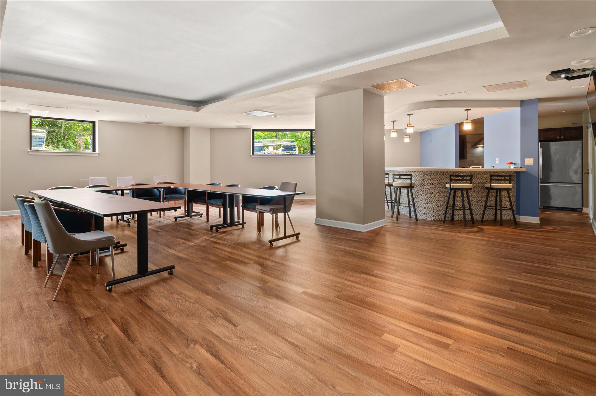 2111 Wisconsin Avenue Northwest, Unit 606 Washington, DC 20007 - Photo 16 of 22 a view of a dining room with furniture and wooden floor