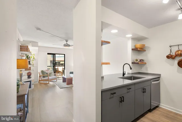 a kitchen with a sink and cabinets