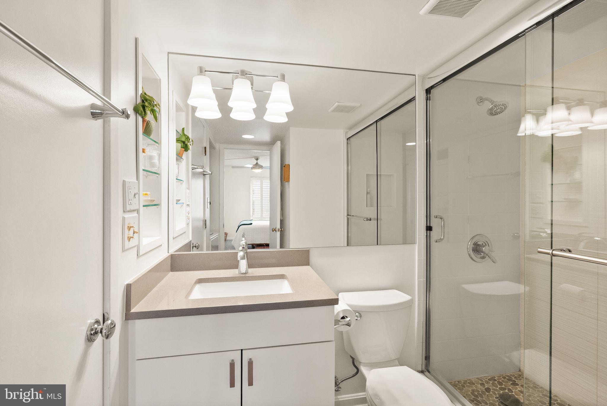 2111 Wisconsin Avenue Northwest, Unit 606 Washington, DC 20007 - Photo 10 of 22 a bathroom with a sink toilet vanity and shower