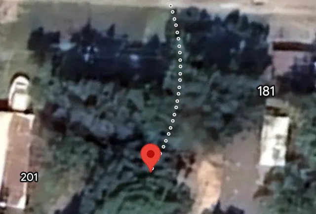 a view of a balcony with wooden floor and city view