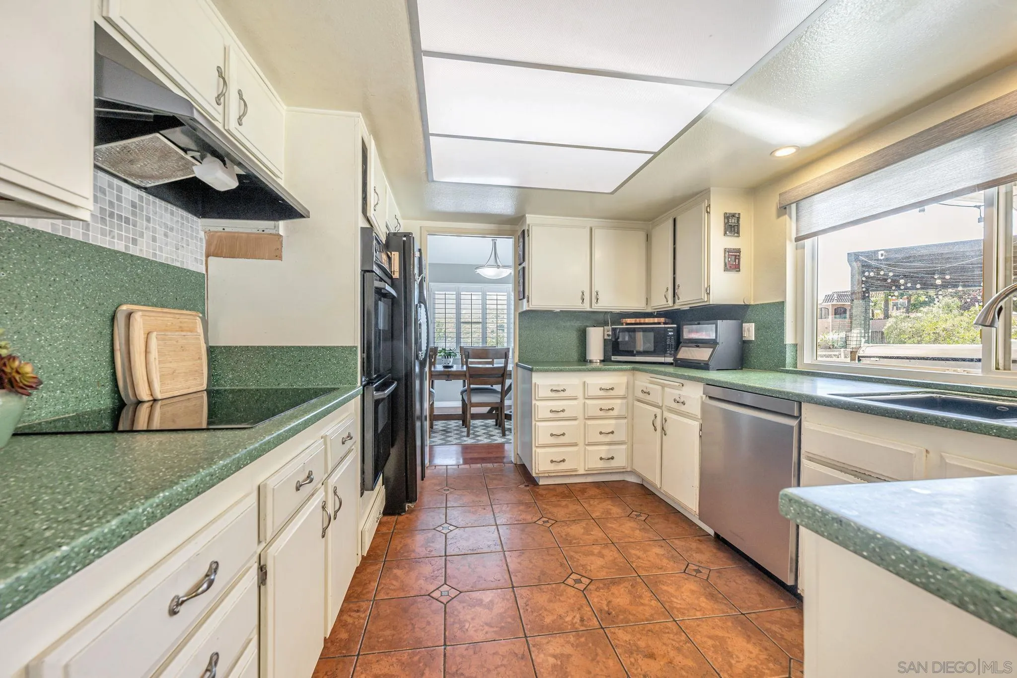 3304 Del Charro Road Jamul, CA 91935 - Photo 11 of 44 a kitchen with stainless steel appliances granite countertop a sink and cabinets
