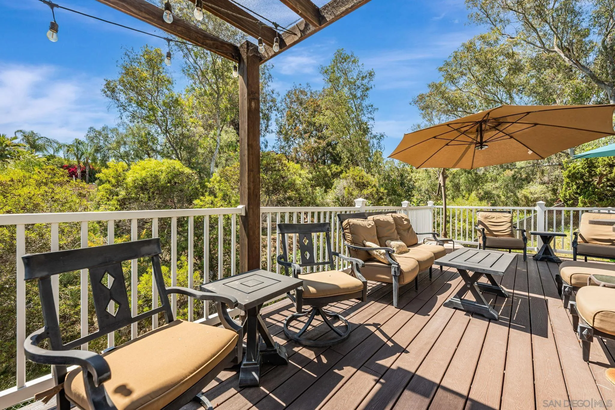 3304 Del Charro Road Jamul, CA 91935 - Photo 36 of 44 a view of a balcony with wooden floor and outdoor seating