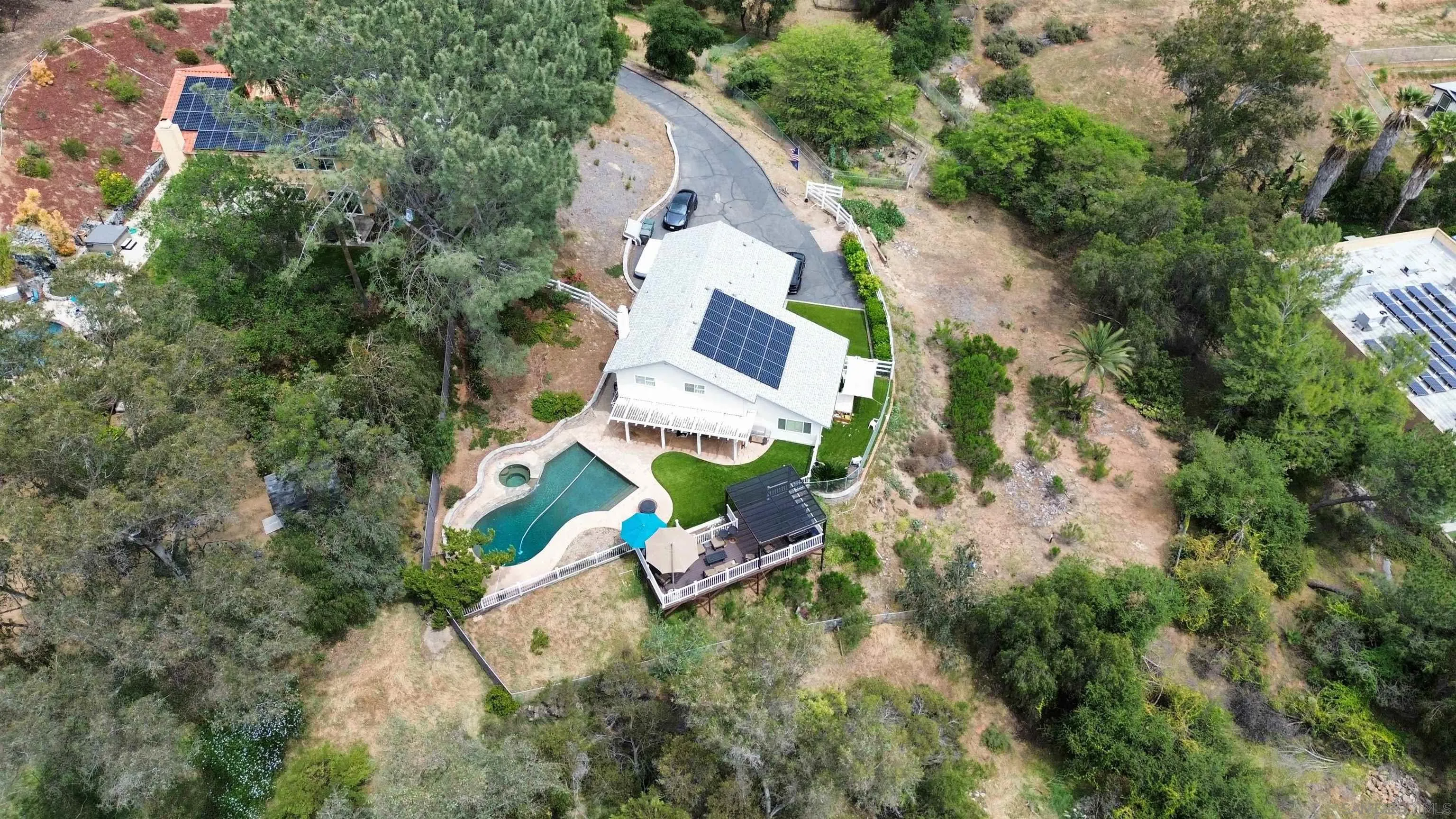 3304 Del Charro Road Jamul, CA 91935 - Photo 42 of 44 an aerial view of a house with a yard and trees