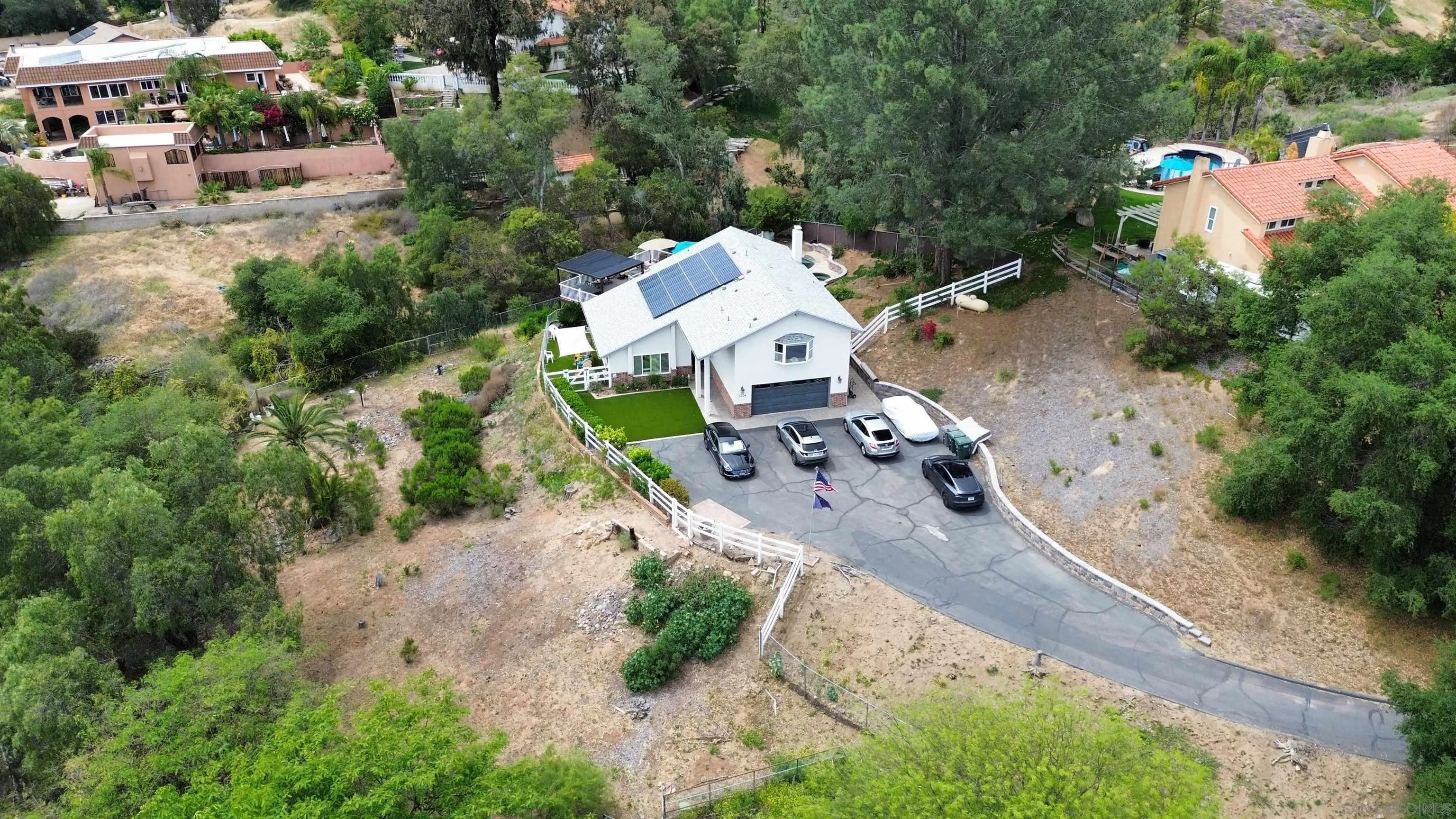 3304 Del Charro Road Jamul, CA 91935 - Photo 43 of 44 an aerial view of a house with a yard and lake view