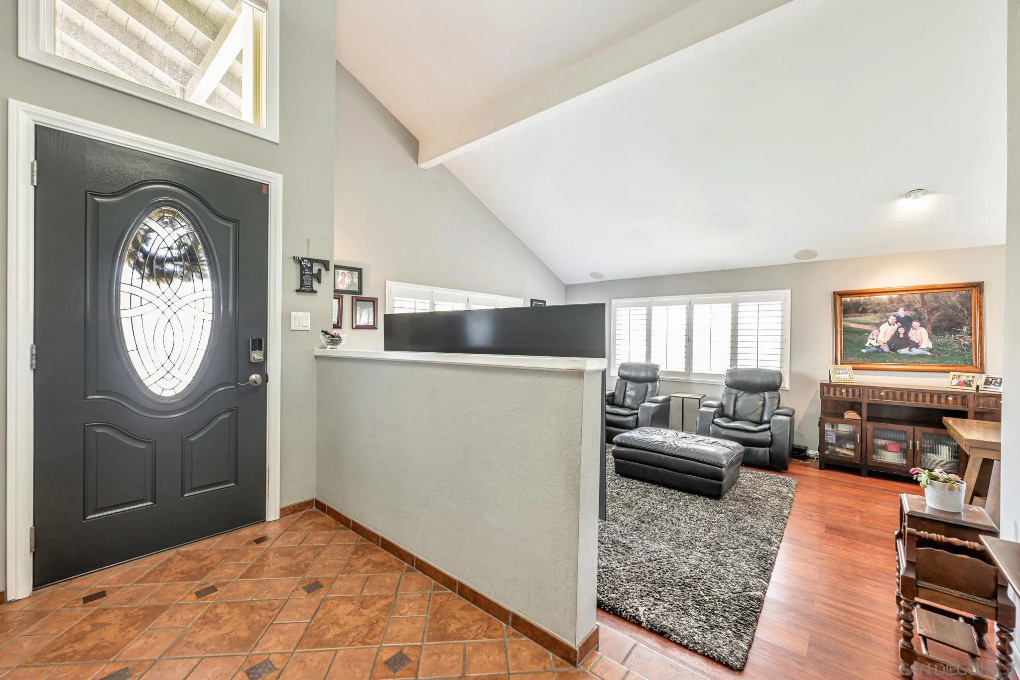 3304 Del Charro Road Jamul, CA 91935 - Photo 6 of 44 a living room with furniture a window and a fireplace