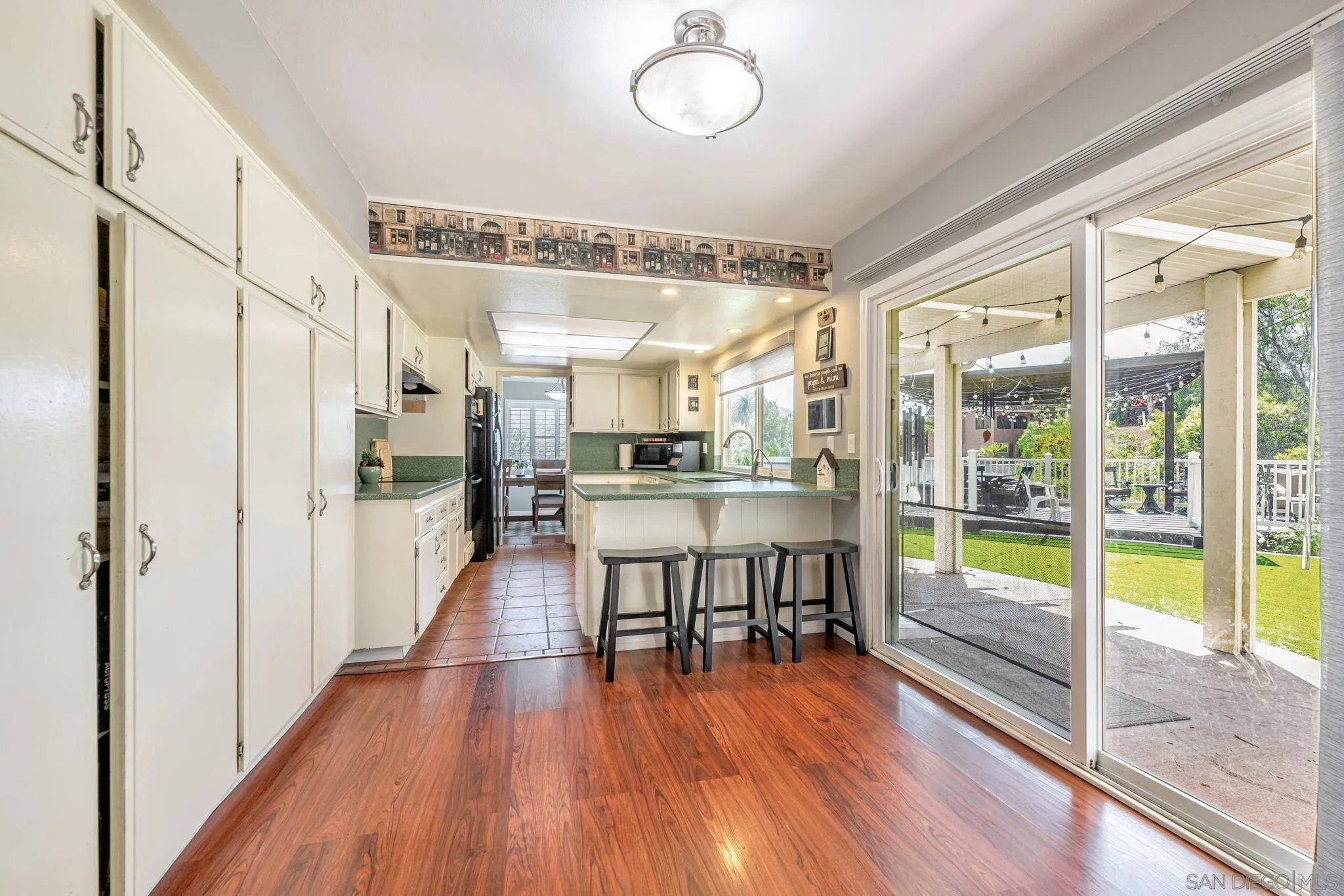 3304 Del Charro Road Jamul, CA 91935 - Photo 10 of 44 a view of a room with wooden floor and windows