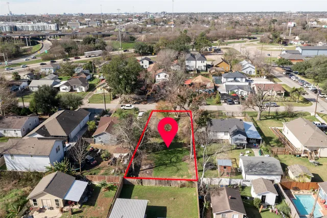 an aerial view of residential houses with outdoor space