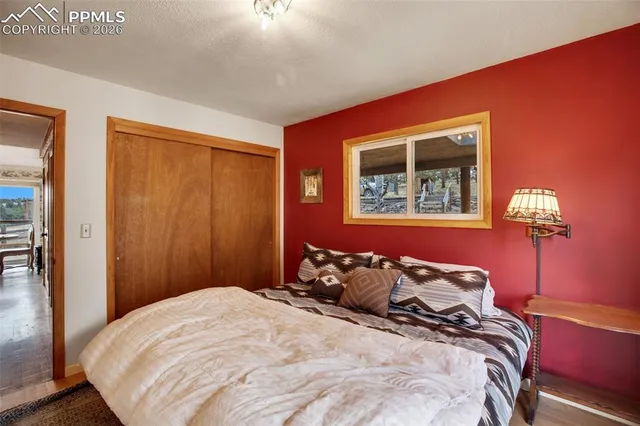 a bedroom with bed and windows