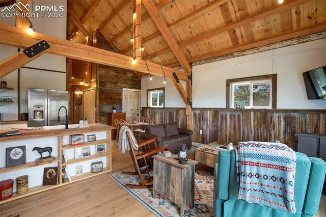 a bedroom with furniture and a book shelf