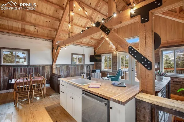 a view of a patio with table and chairs