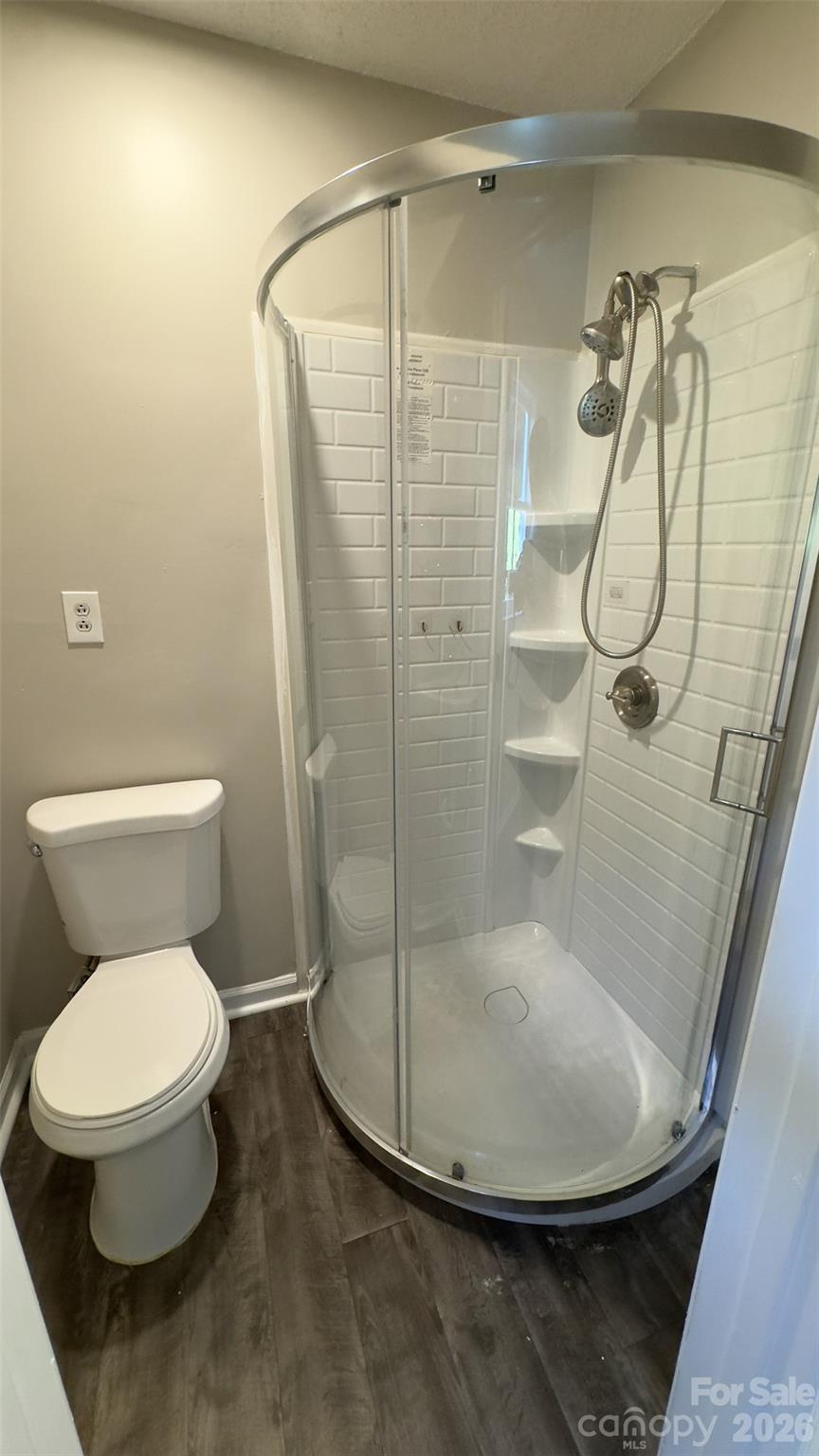 3014 Morgan Mill Road Monroe, NC 28110 - Photo 11 of 26 a bathroom with a toilet and a shower