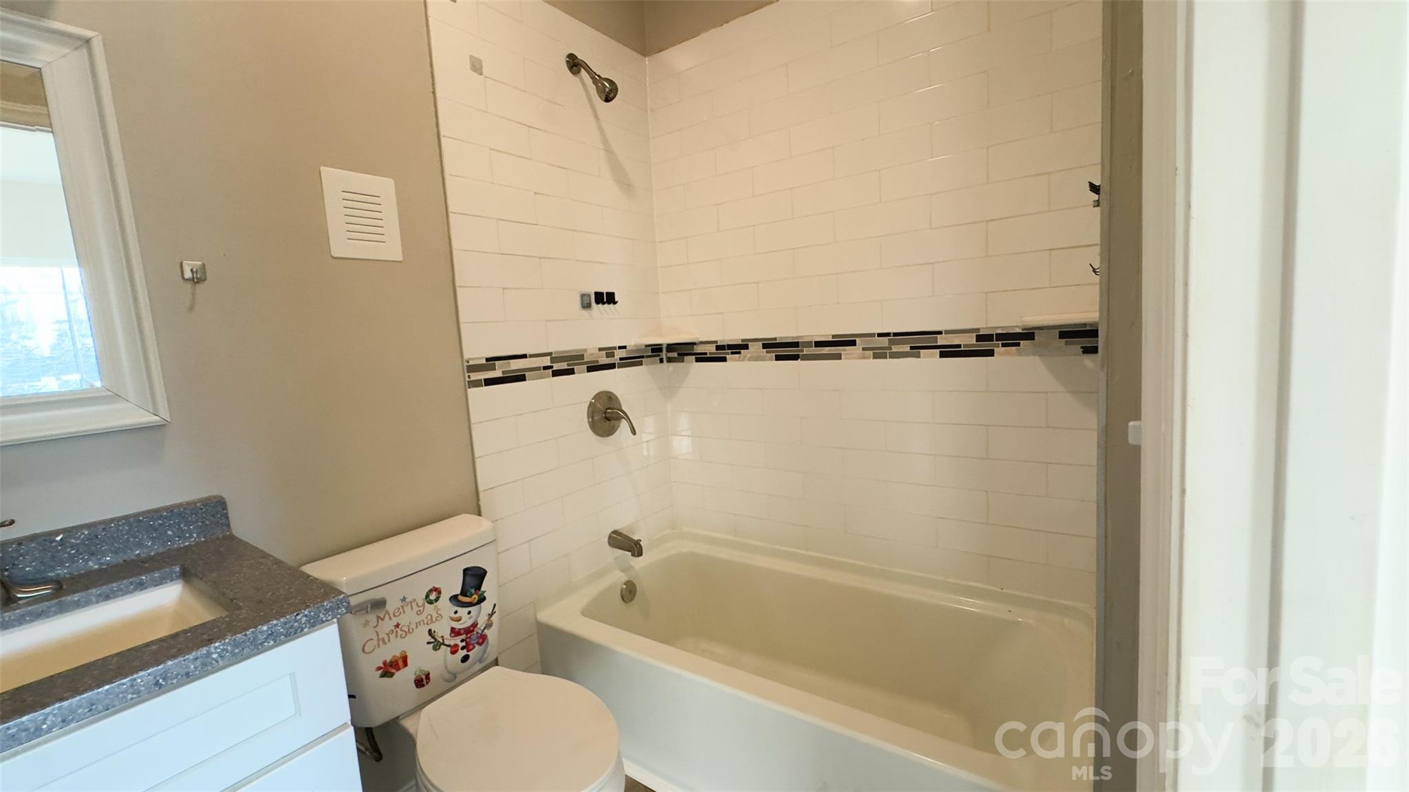 3014 Morgan Mill Road Monroe, NC 28110 - Photo 17 of 26 a bathroom with a shower toilet and bathtub