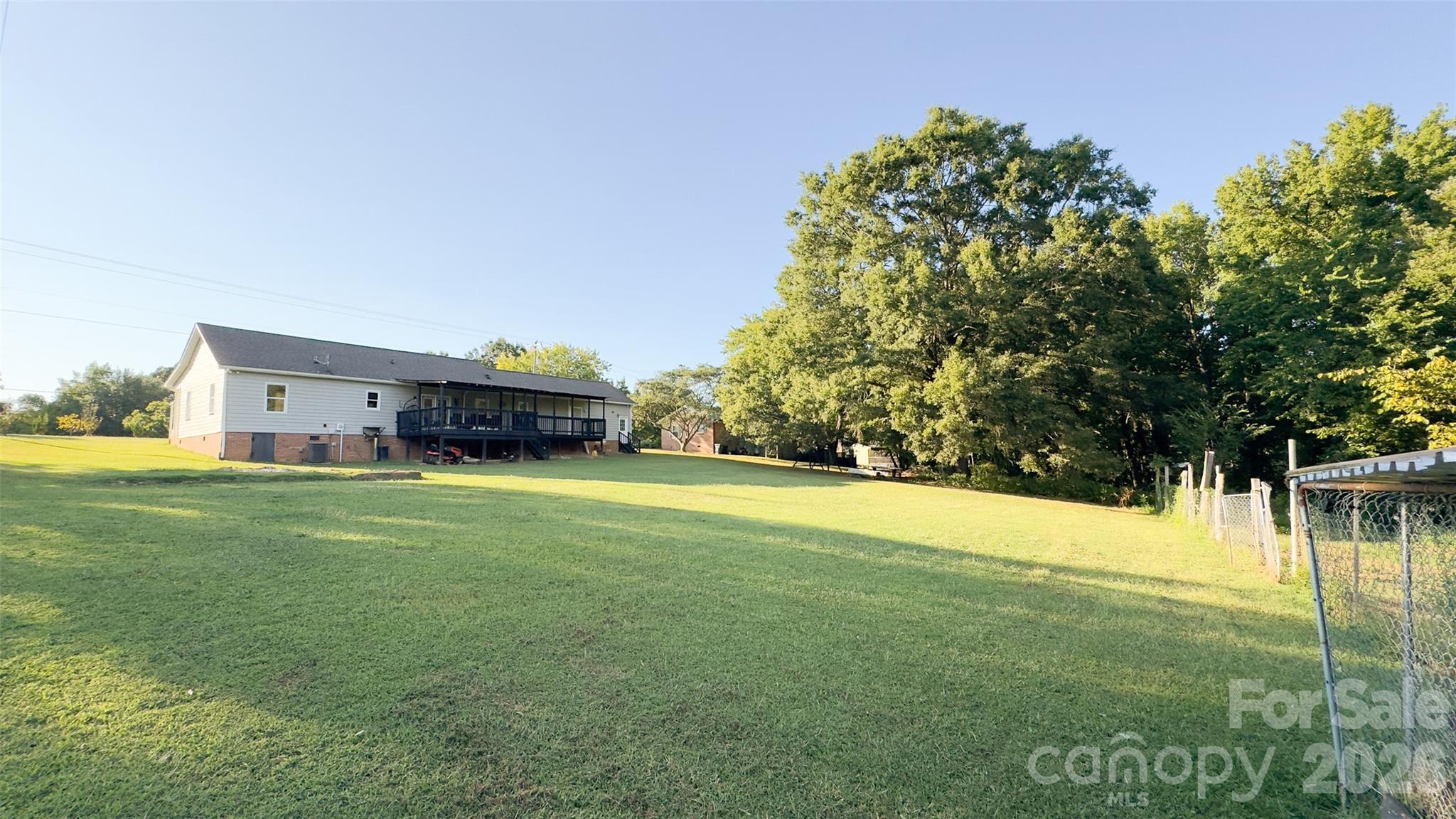 3014 Morgan Mill Road Monroe, NC 28110 - Photo 20 of 26 a car parked in front of a house with a big yard