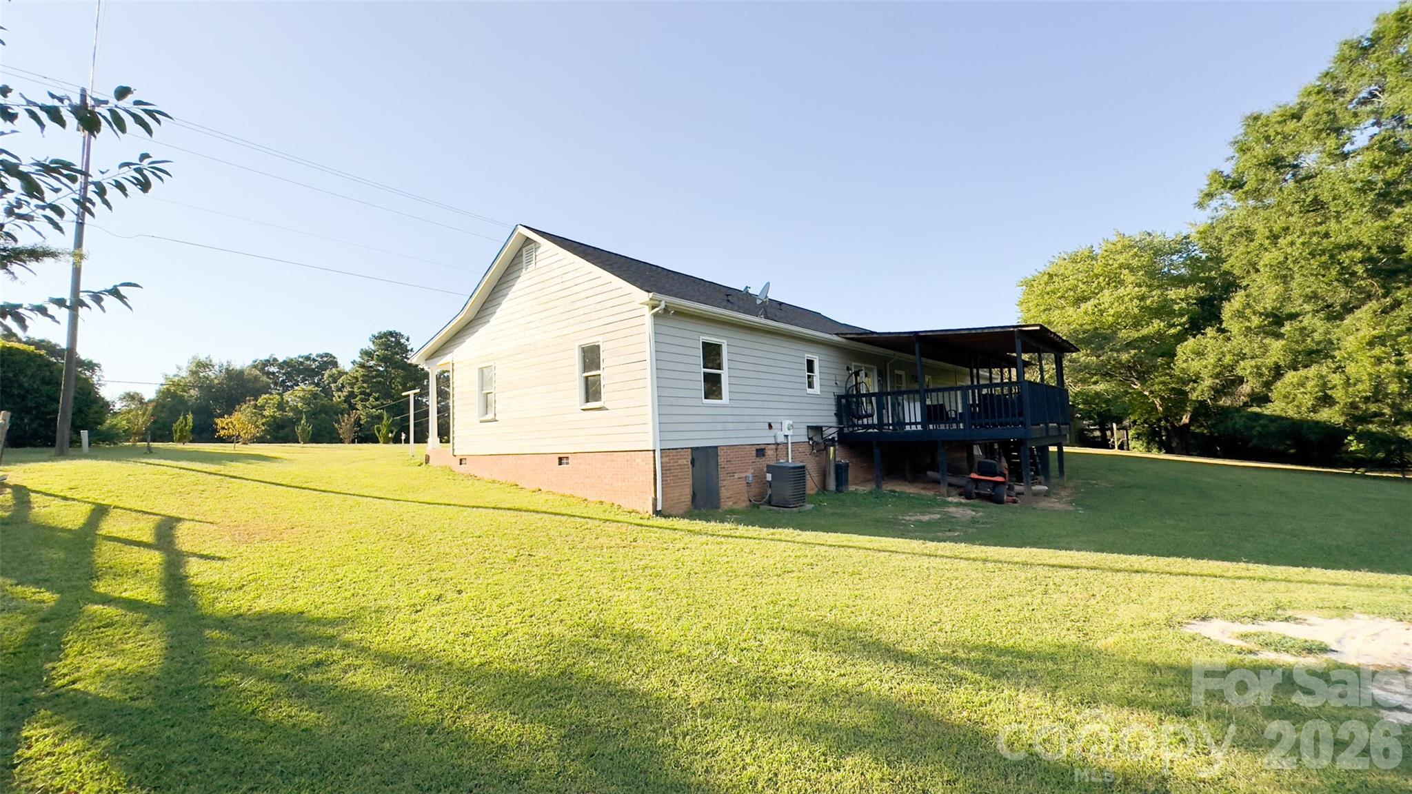3014 Morgan Mill Road Monroe, NC 28110 - Photo 21 of 26 a view of a house with pool and a yard