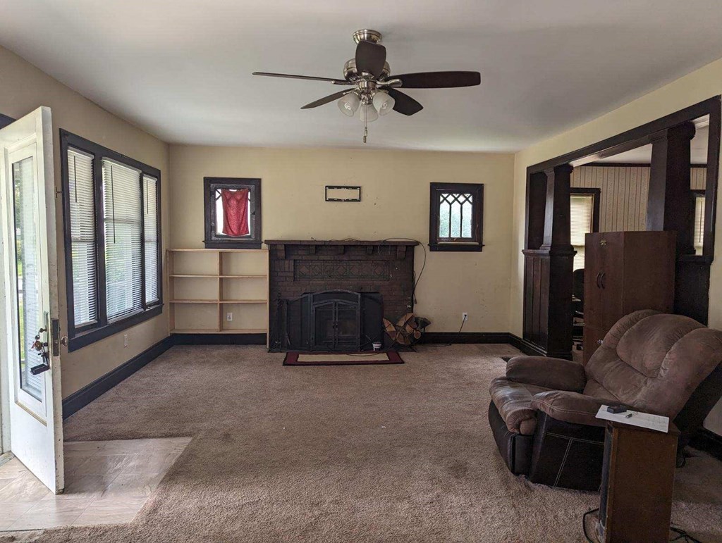 477 Chestnut Street Rimersburg, PA 16248 - Photo 3 of 13 a living room with furniture and a fireplace