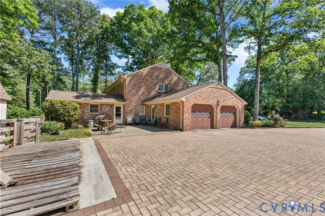 5700 Elfinwood Road Chester, VA 23831 - Photo 33 of 38 a front view of a house with a yard and trees