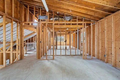 a view of an empty room with stairs