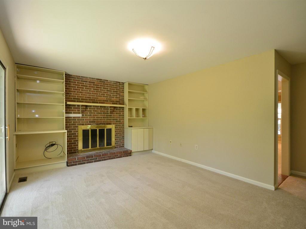 17 Pebble Ridge Court Potomac, MD 20854 - Photo 13 of 29 a view of an empty room with a fireplace