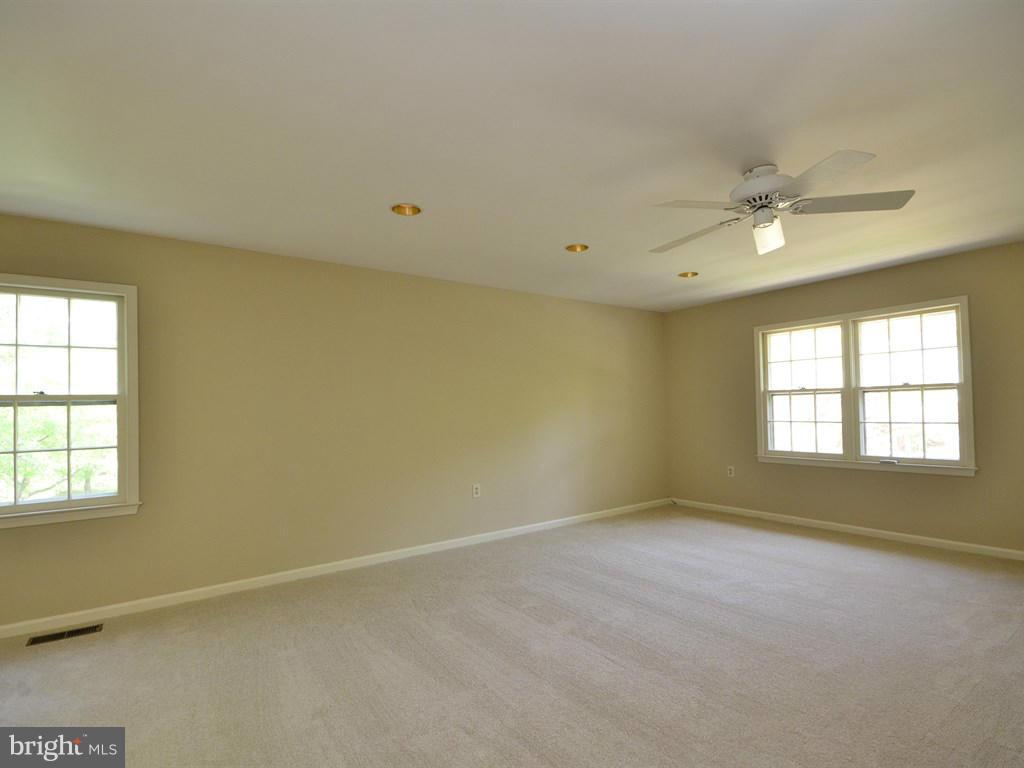 17 Pebble Ridge Court Potomac, MD 20854 - Photo 15 of 29 an empty room with a window and a fan