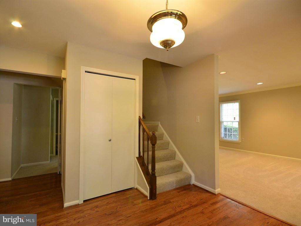 17 Pebble Ridge Court Potomac, MD 20854 - Photo 3 of 29 a view of a hallway with wooden floor and entryway