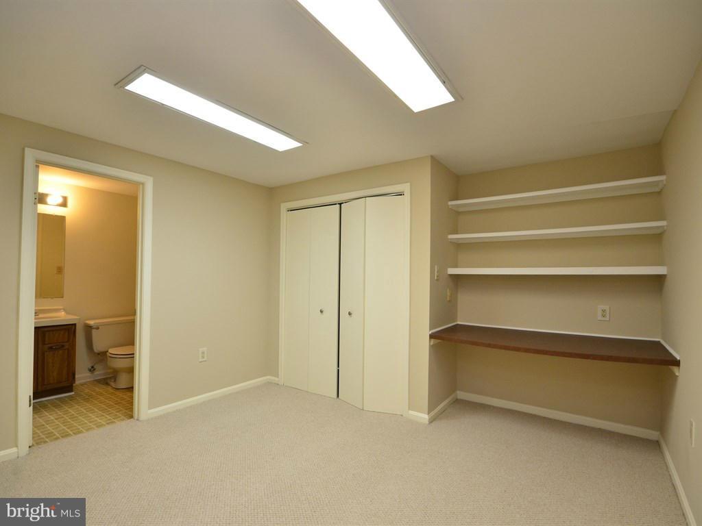 17 Pebble Ridge Court Potomac, MD 20854 - Photo 26 of 29 a view of room with a ceiling fan
