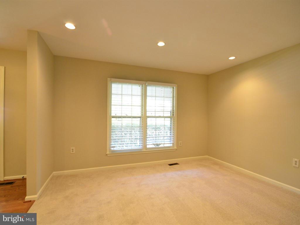 17 Pebble Ridge Court Potomac, MD 20854 - Photo 6 of 29 a view of an empty room with a window