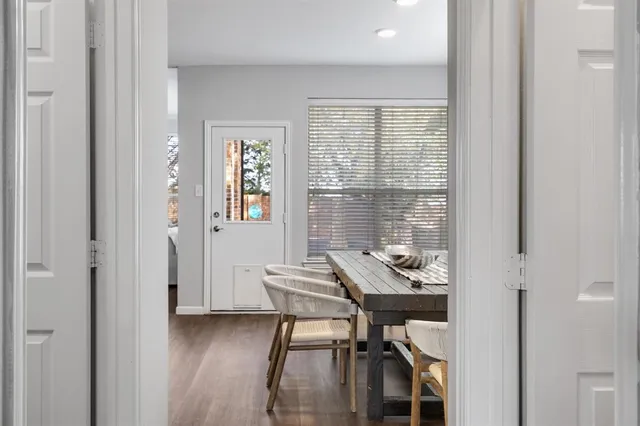 a view of a dining room with furniture and window