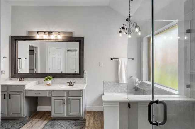 a bathroom with a sink double vanity and a mirror