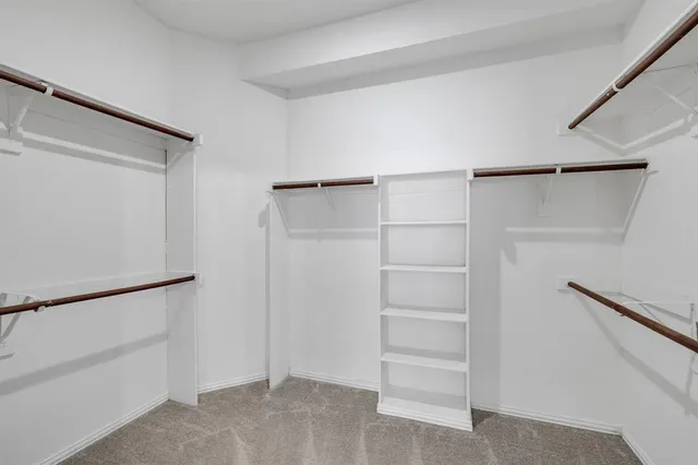 a view of an empty walk in closet