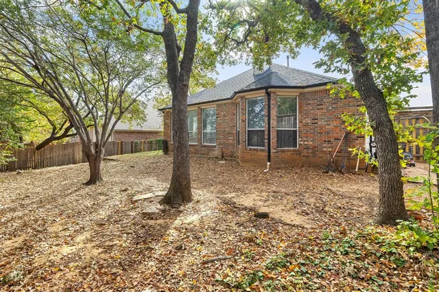 a backyard of a house with lots of green space