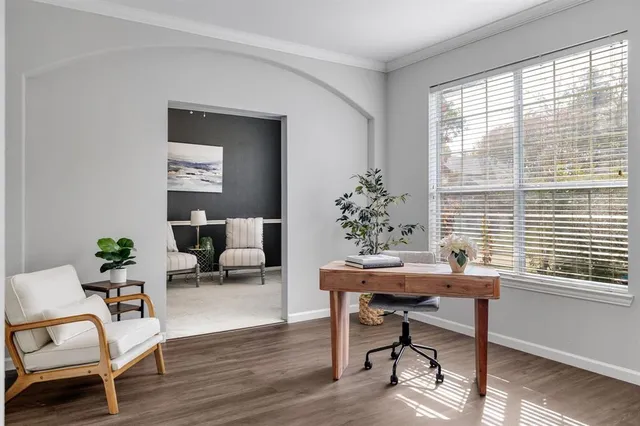 a workspace with furniture window and wooden floor