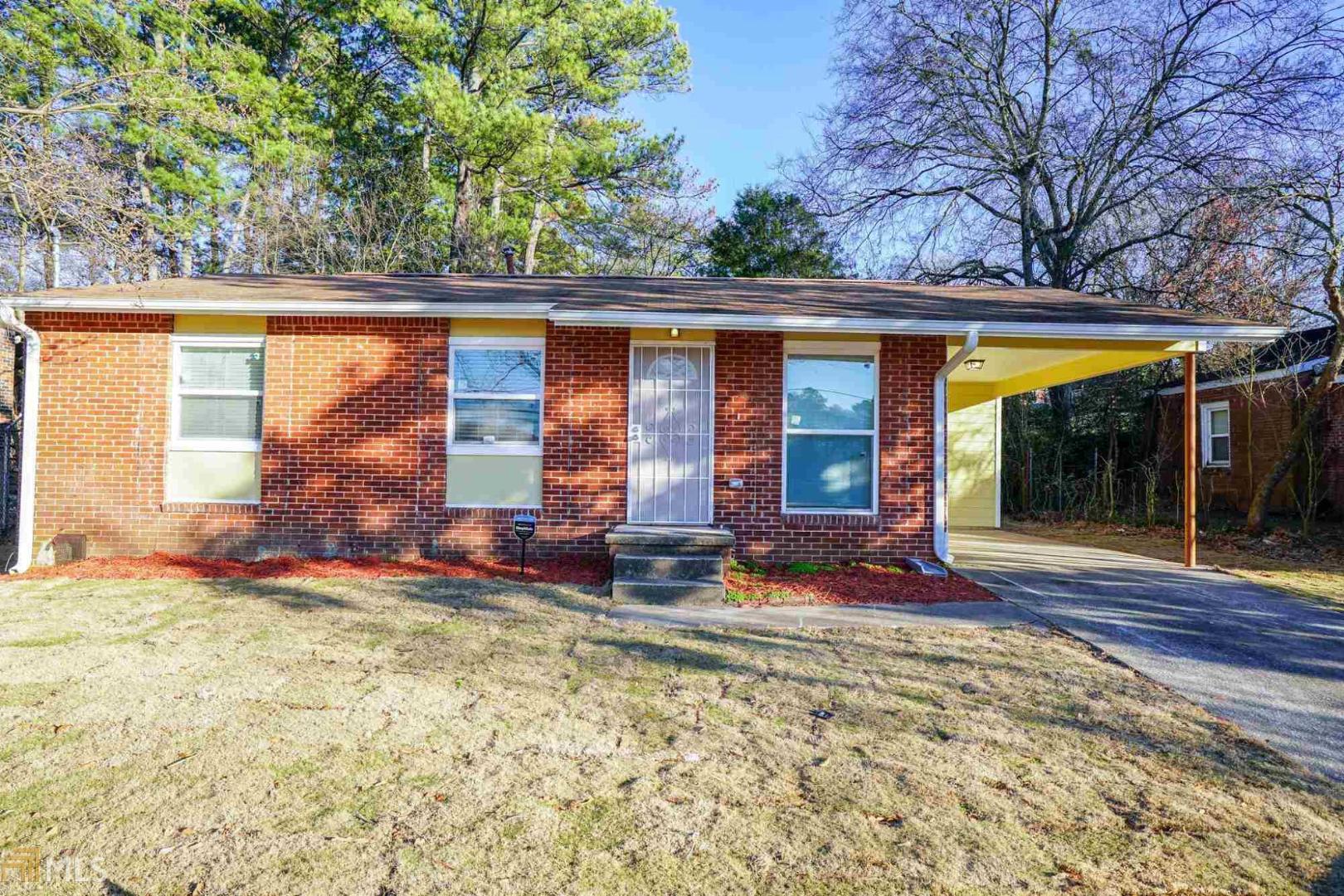 455 Bolton Road Northwest Atlanta, GA 30331 - Photo 1 of 1 a view of a house with backyard and sitting area