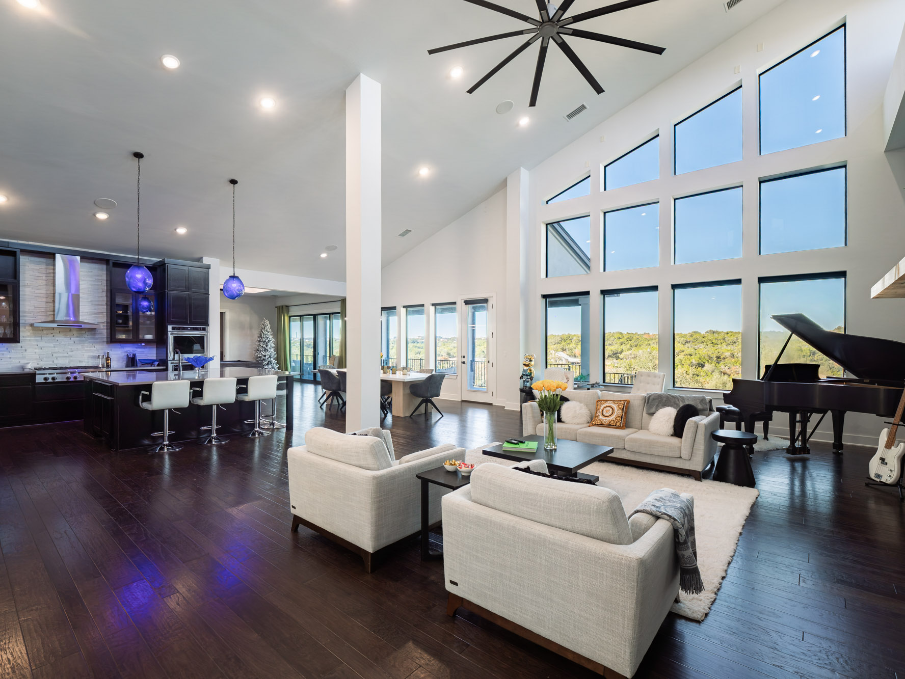 14900 Copper Ridge Lane Austin, TX 78734 - Photo 5 of 39 Living area featuring dark wood-style flooring, high vaulted ceiling, and recessed lighting