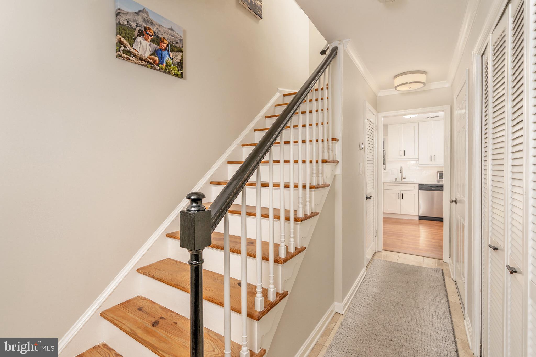 5050 Bradley Boulevard, Unit 6 Chevy Chase, MD 20815 - Photo 12 of 25 a view of a hallway with wooden floor and entryway